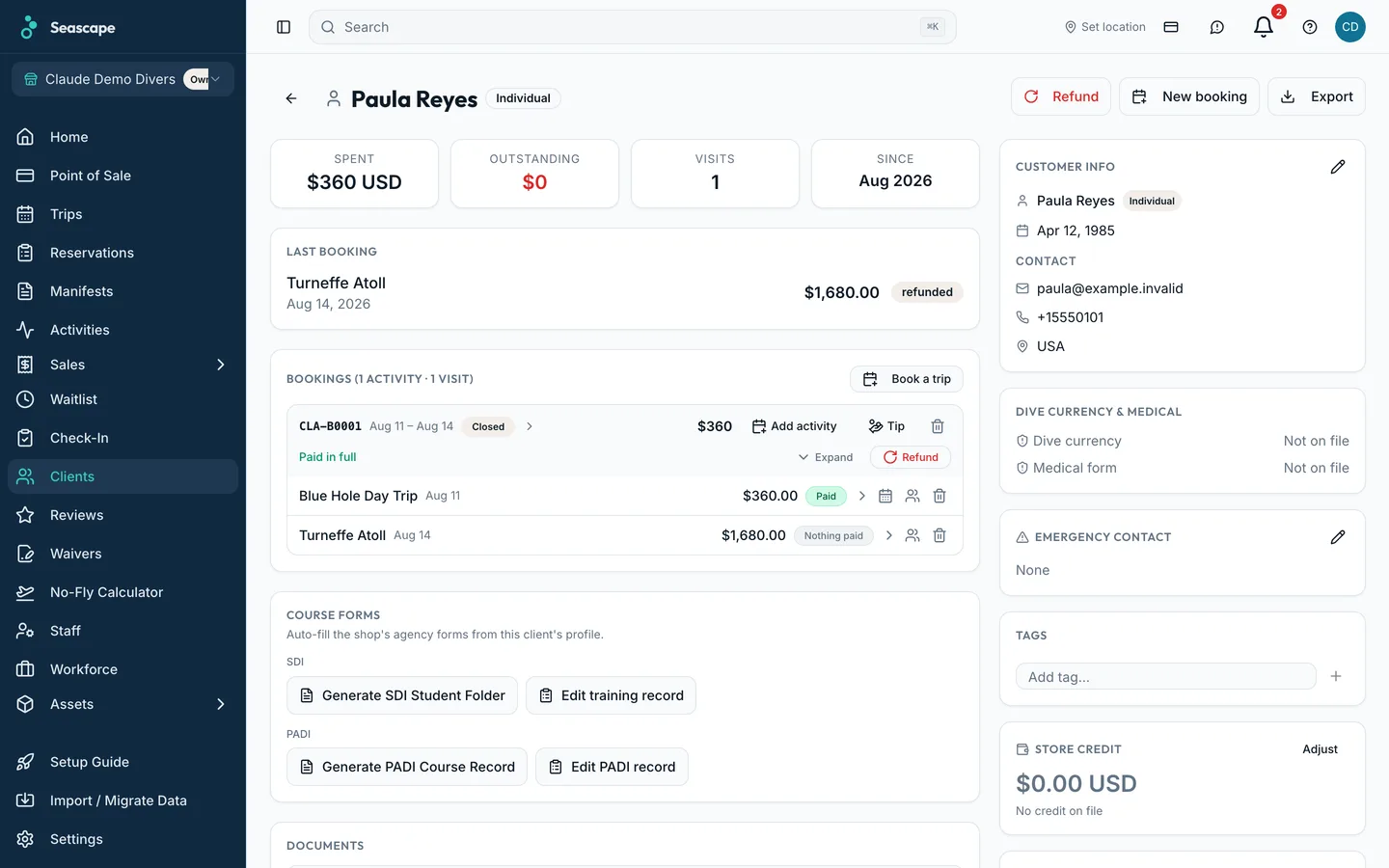 A customer's record: certification, dive history, every booking and payment in one place.